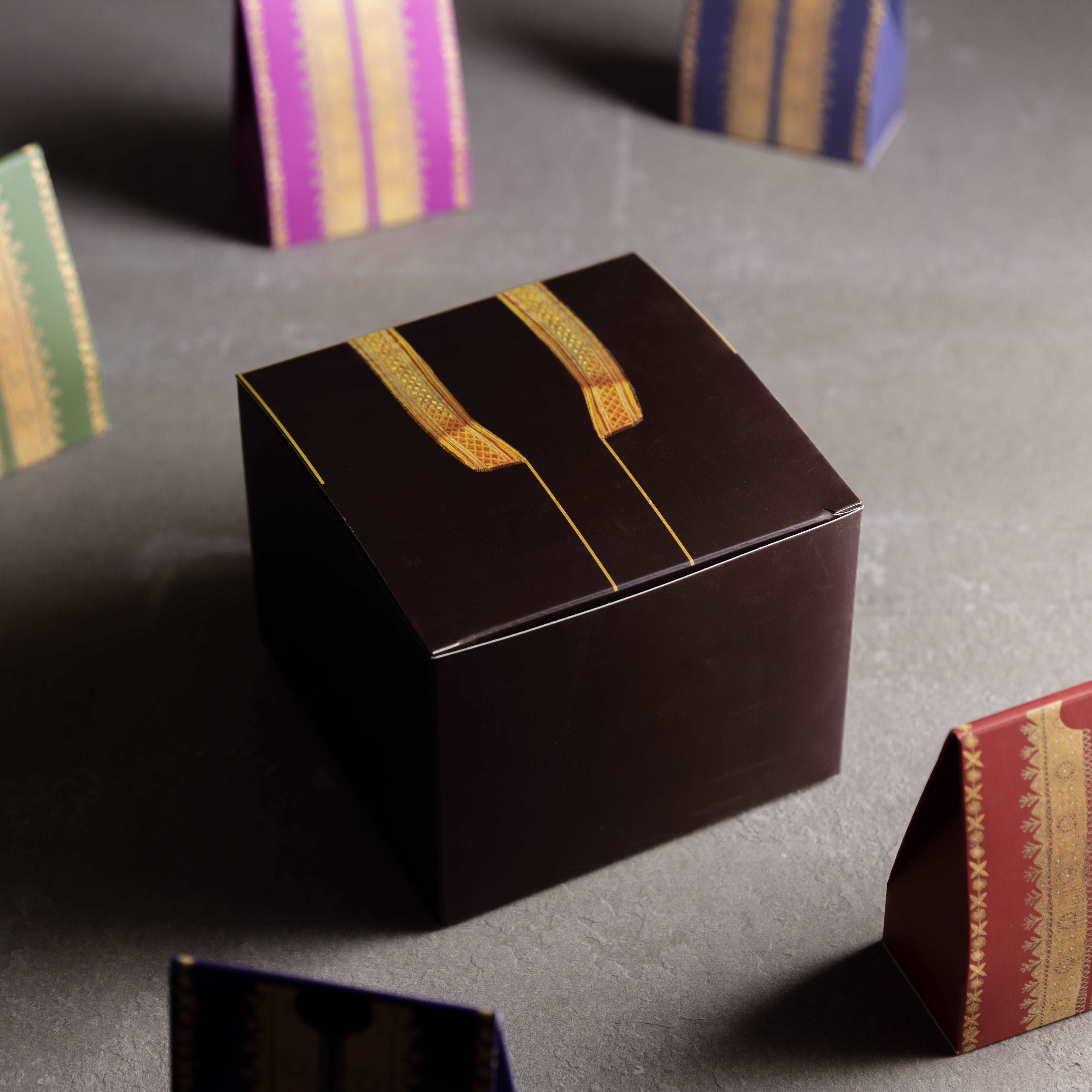 bisht design brown gift box on table