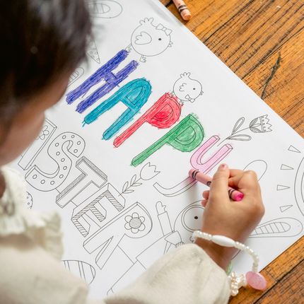 a kid coloring one paper