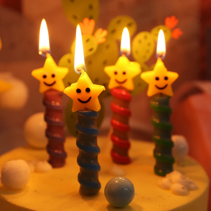 birthday candles lit over a cake
