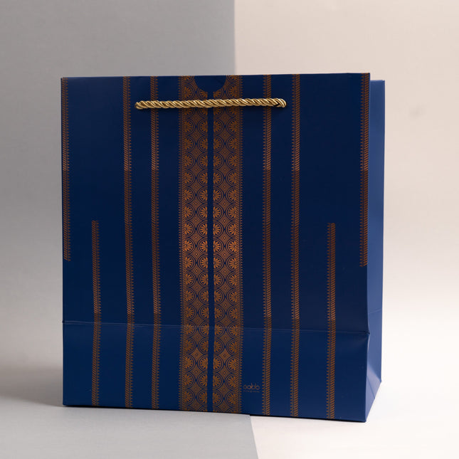 blue color gift bag with thobe nashal design